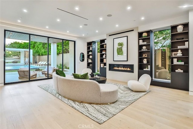 living area with light hardwood / wood-style flooring