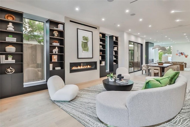 living area with light hardwood / wood-style flooring