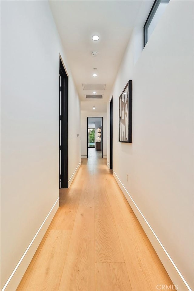 corridor featuring light hardwood / wood-style flooring