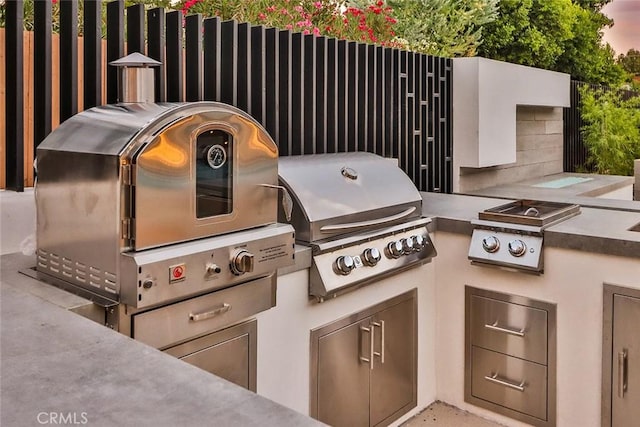 view of patio / terrace featuring area for grilling and exterior kitchen