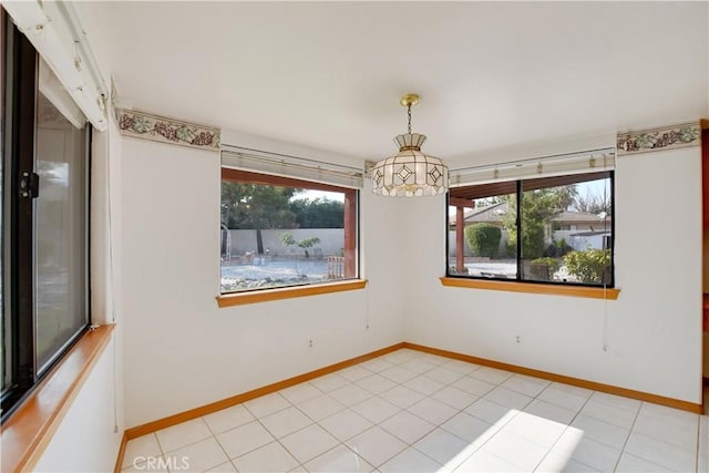 spare room featuring baseboards