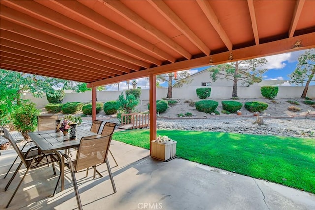 view of patio featuring a fenced backyard and outdoor dining area