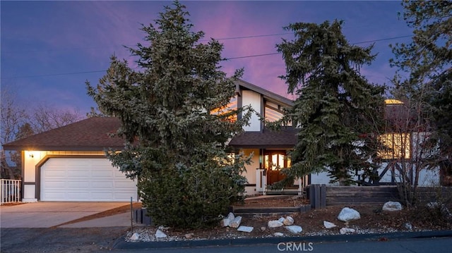 obstructed view of property featuring a garage