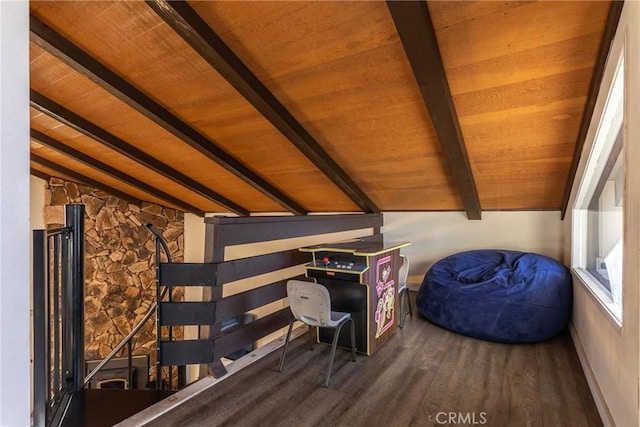 unfurnished bedroom featuring wood ceiling, hardwood / wood-style floors, and vaulted ceiling with beams