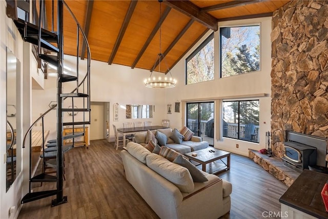 living room with wood ceiling, dark wood-type flooring, high vaulted ceiling, a notable chandelier, and beamed ceiling