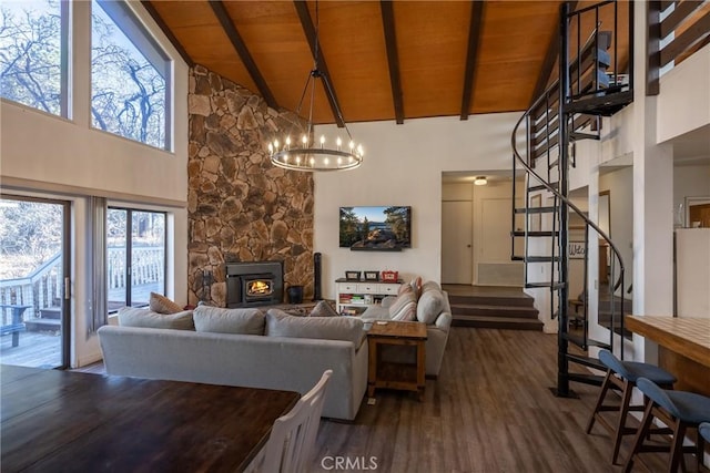 living room featuring dark hardwood / wood-style flooring, a notable chandelier, wood ceiling, and beamed ceiling