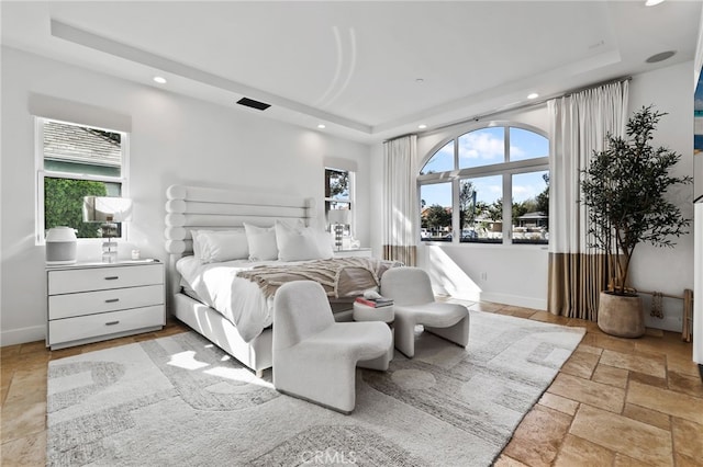 bedroom with a raised ceiling