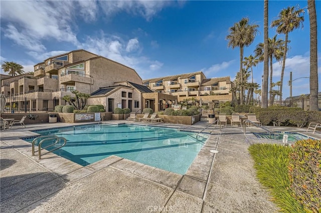 view of swimming pool featuring a patio area