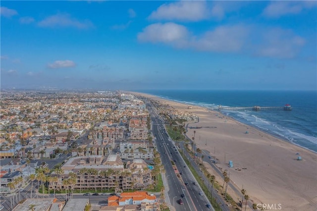 aerial view with a water view and a view of the beach