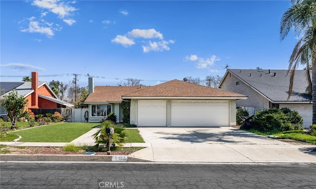 view of front of property with a front lawn, concrete driveway, an attached garage, and stucco siding