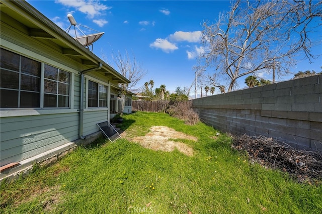 view of yard with a fenced backyard