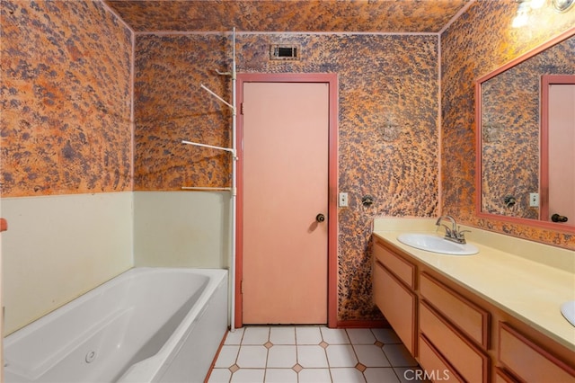 full bathroom featuring a sink, visible vents, a jetted tub, double vanity, and wallpapered walls