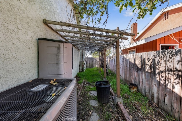 view of yard featuring central AC unit and a fenced backyard