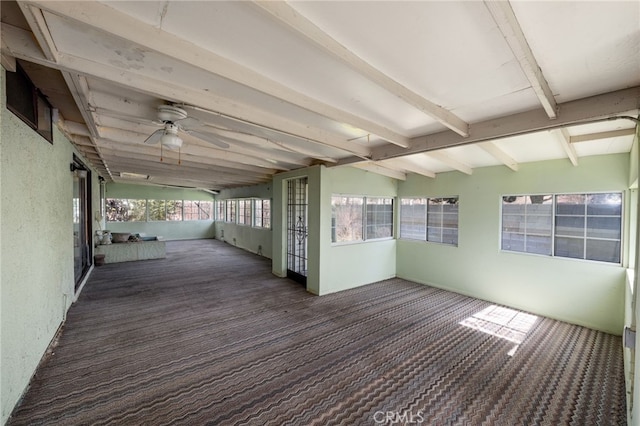 wooden terrace with a ceiling fan