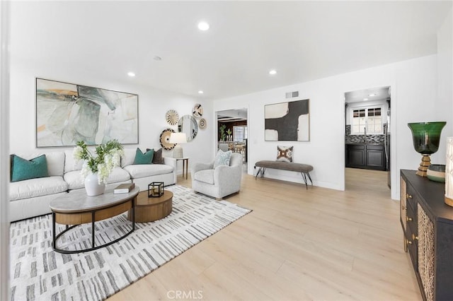 living room with light hardwood / wood-style floors