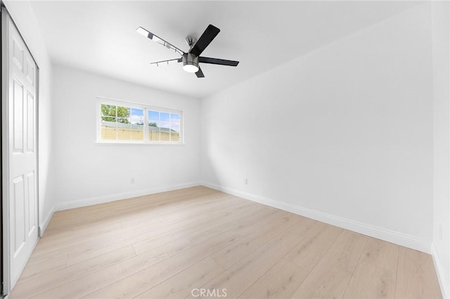 unfurnished bedroom with ceiling fan, a closet, and light hardwood / wood-style flooring