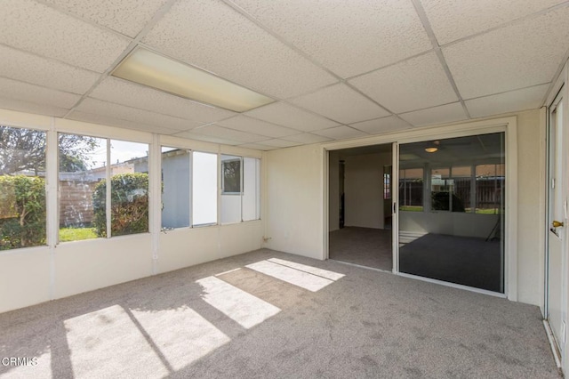 unfurnished sunroom featuring a paneled ceiling