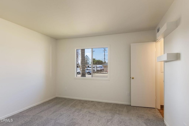 empty room with light colored carpet