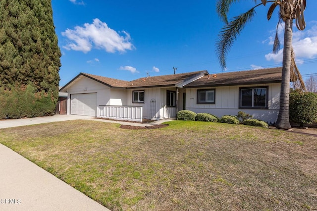 ranch-style home with a garage and a front lawn