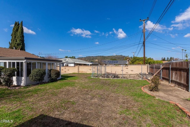 view of yard featuring a sunroom