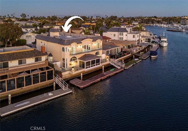 birds eye view of property featuring a water view