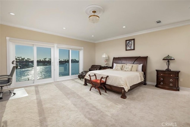 bedroom featuring baseboards, visible vents, a water view, crown molding, and recessed lighting