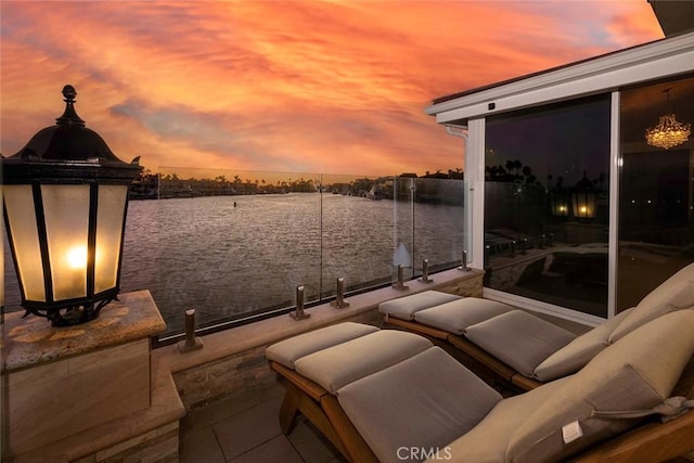 view of patio with a water view