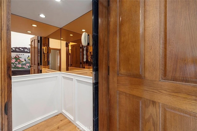 interior details featuring wood finished floors and recessed lighting