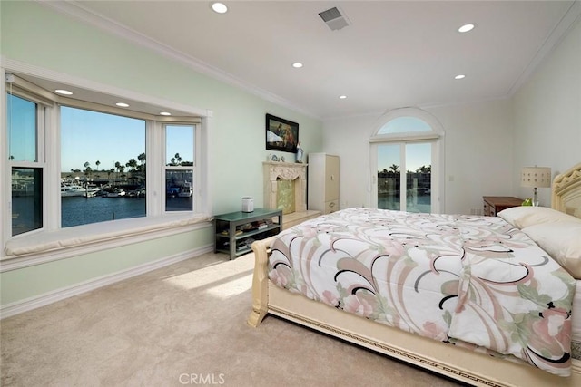 bedroom featuring ornamental molding, light carpet, a water view, and baseboards