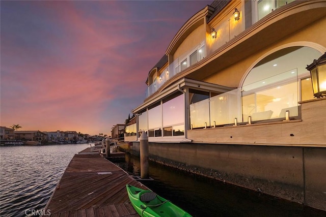 dock area with a water view