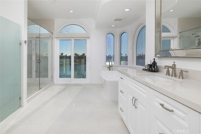 full bath with a soaking tub, visible vents, a shower stall, vanity, and tile patterned flooring