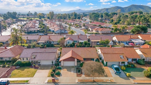 birds eye view of property with a mountain view