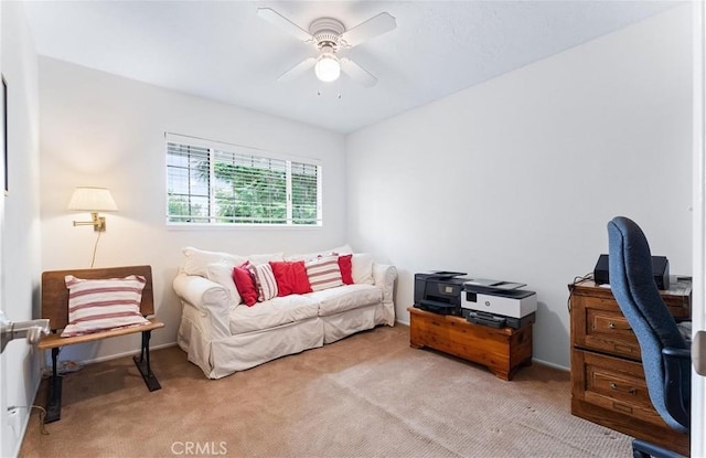 home office featuring light colored carpet and ceiling fan