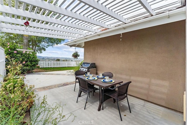 view of patio / terrace featuring a grill and a pergola