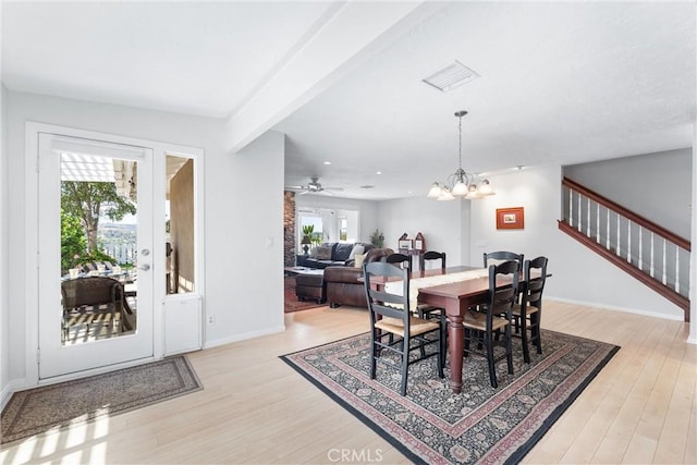 dining room with an inviting chandelier and light hardwood / wood-style flooring