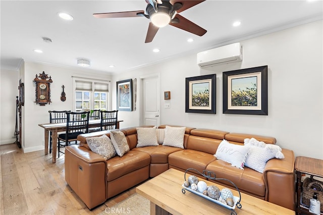 living room with ceiling fan, ornamental molding, a wall mounted air conditioner, and light hardwood / wood-style flooring