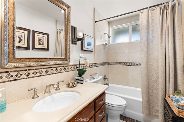 full bathroom featuring vanity, tile walls, shower / bath combo with shower curtain, and toilet