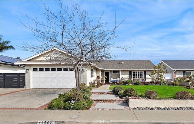 single story home with a garage and a front yard