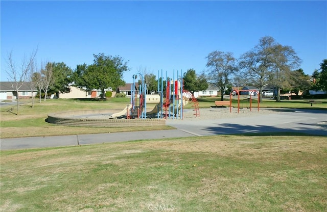 view of playground with a lawn