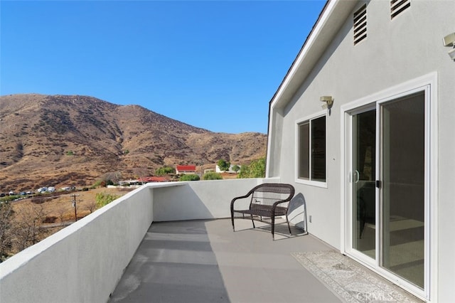 balcony featuring a mountain view