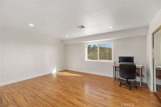 office with light hardwood / wood-style floors