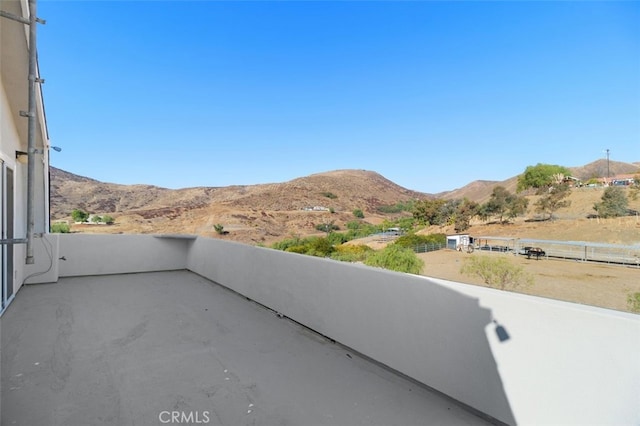 balcony featuring a mountain view