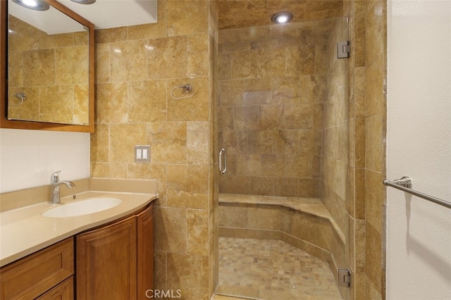 bathroom featuring vanity and walk in shower