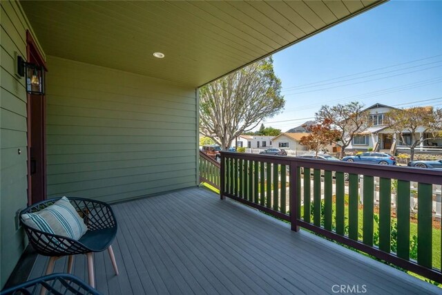 wooden deck featuring covered porch