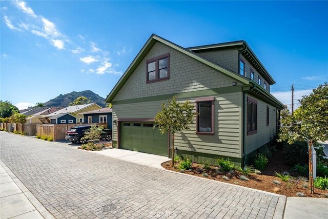 view of property exterior with a mountain view