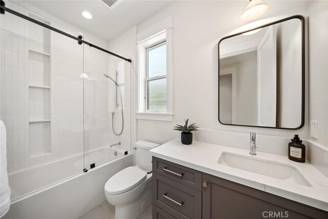 full bathroom with vanity, toilet, and tiled shower / bath combo