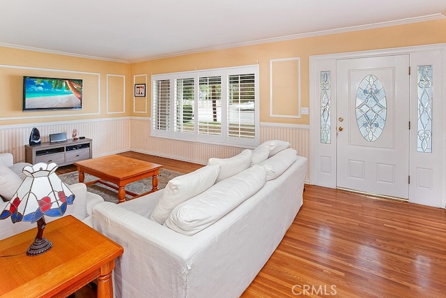 living room featuring crown molding and wood-type flooring