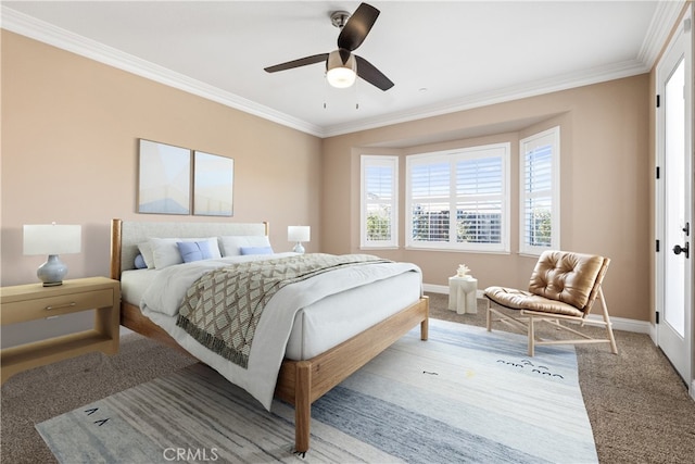 carpeted bedroom featuring ornamental molding and ceiling fan