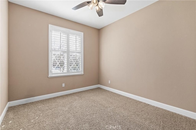 carpeted empty room with ceiling fan