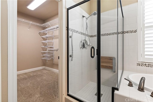 bathroom with separate shower and tub